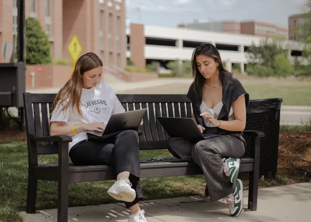 Students on bench in Raleigh